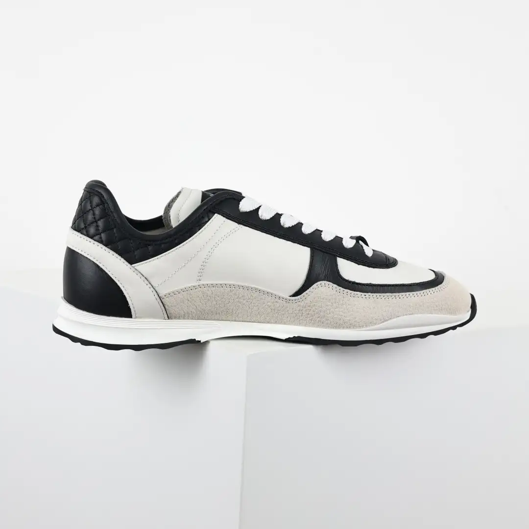 Chanel 25 Low-Top Sneakers - Image 1